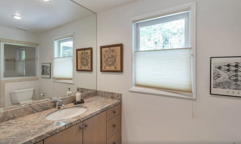 bathroom with steam shower next to office
