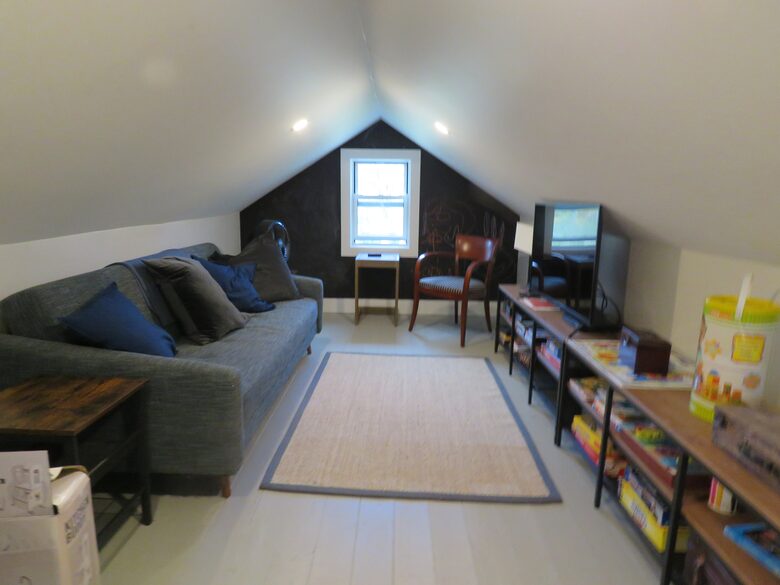 Home Exchange in Hillsdale, NY play room with seating, tv, and toys