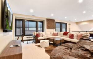 Loft with large sofa and pool table
