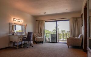 Home Exchange in Napa, CA bedroom with vanity and balcony