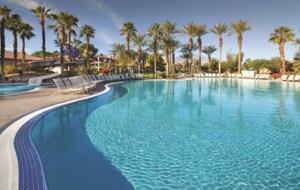 Home Exchange in Pam Desert, CA resort pool under the palms