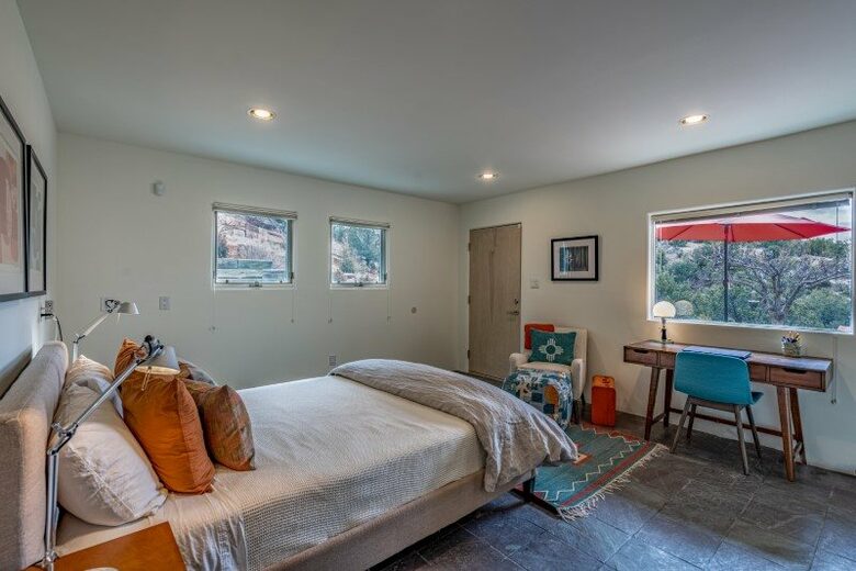 Guest bedroom with desk. Private patio.