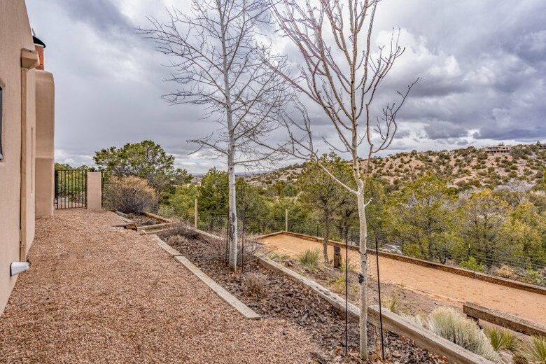 Bocce court and fenced in area for dogs.