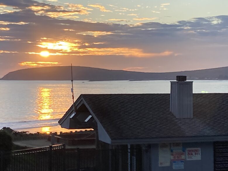 Sunset at Bodega Harbor over HOA Clubhouse.