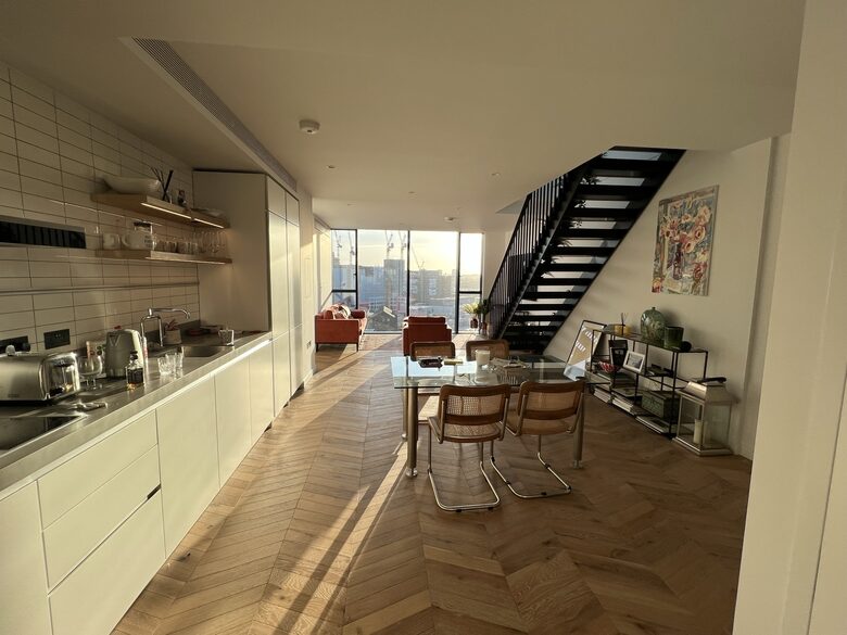 kitchen, living and steps to roof terrace