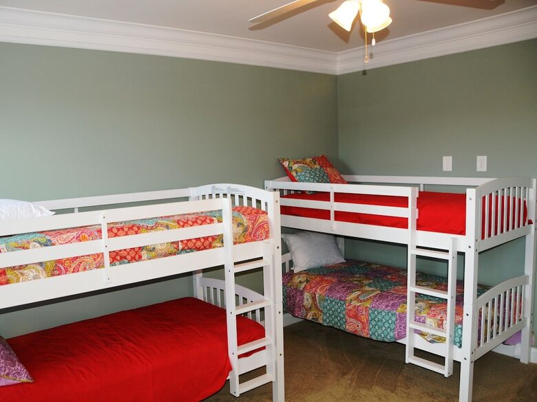 Second Floor Bedroom with Two Bunk Beds, Dresser, TV and Full Bath