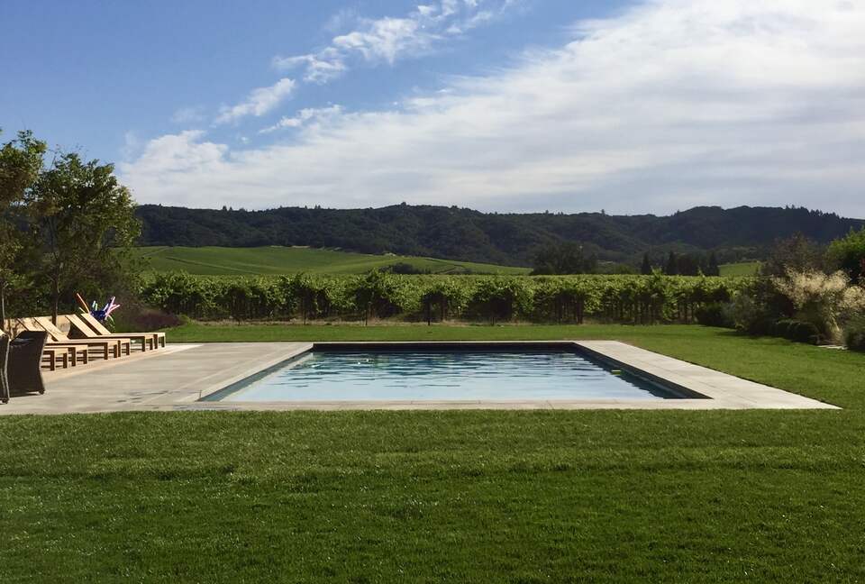 Solar-heated pool surrounded by vineyards