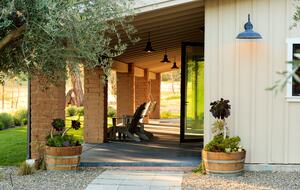 Porch runs the length of the house and faces the mountains.