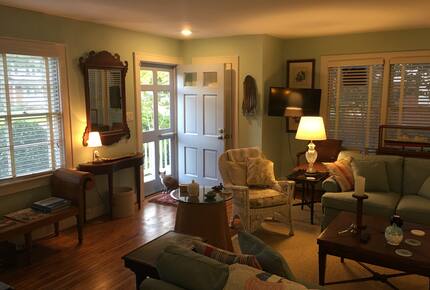 Living room furnished with antiques and comfortable seating