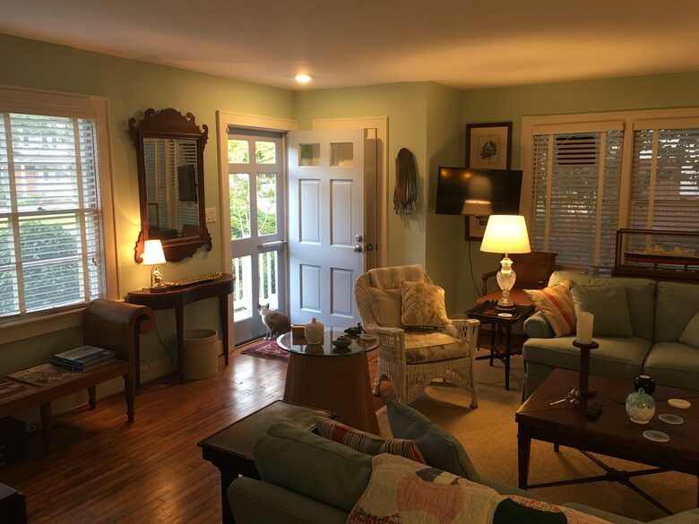 Living room furnished with antiques and comfortable seating