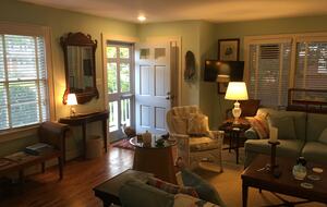 Living room furnished with antiques and comfortable seating