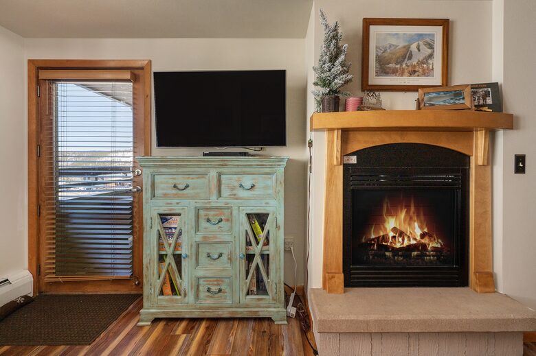Fireplace, entertainment center, balcony door