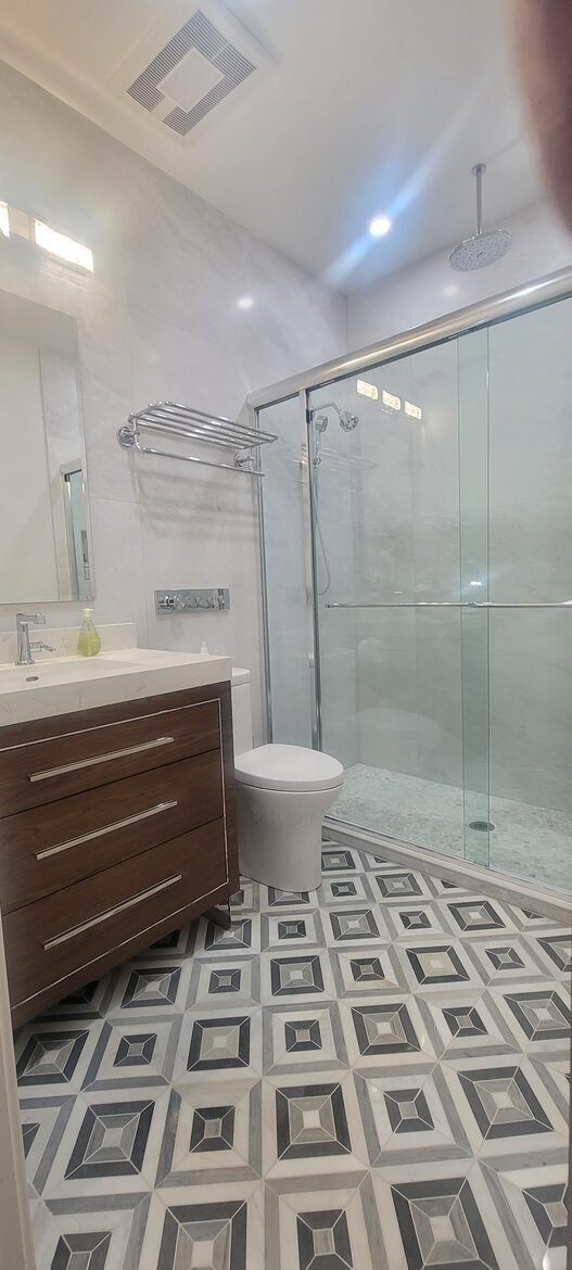 New bathroom with heads on each end, rain & hand showers