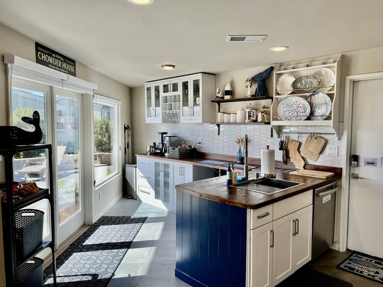Kitchen with side yard and hot tub in background.