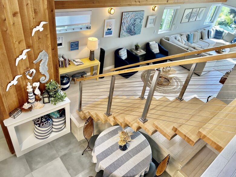 Looking from landing to stairs and living room.