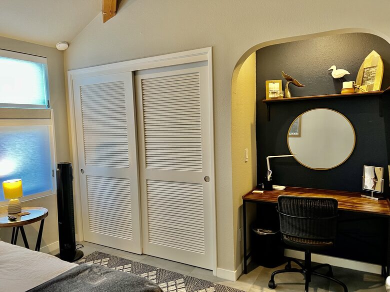 Closet and desk area downstairs bedroom.