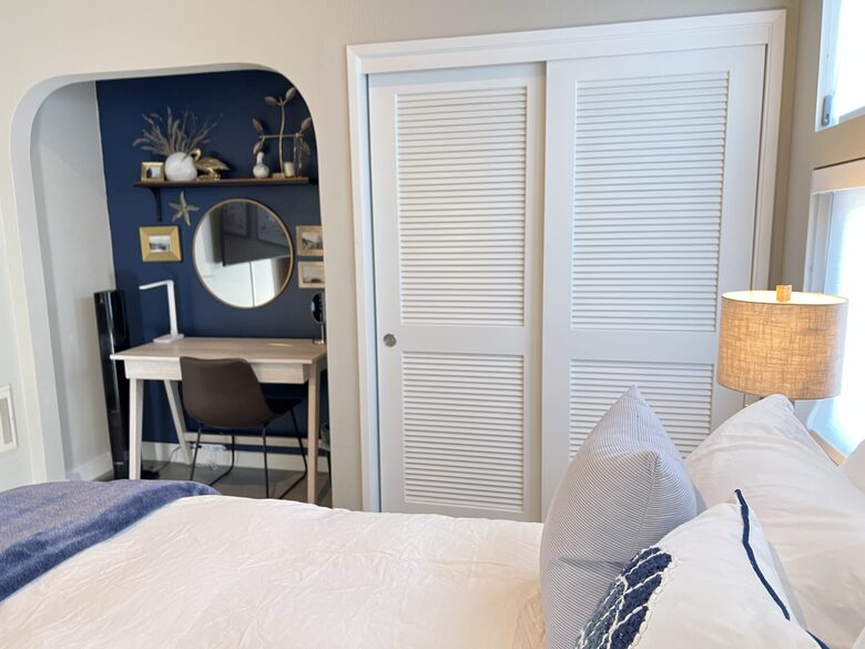 Desk and closet area with Fall/Winter bedding.