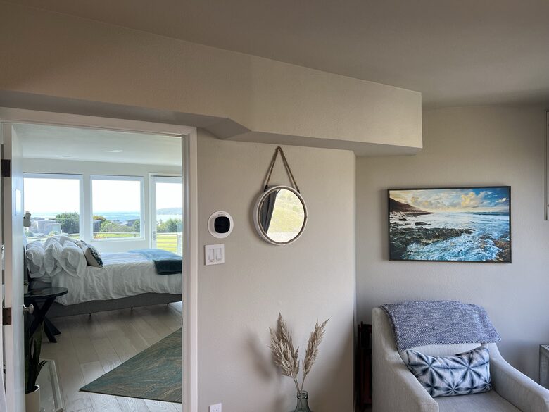 Looking into primary bedroom from landing area “the Bridge”