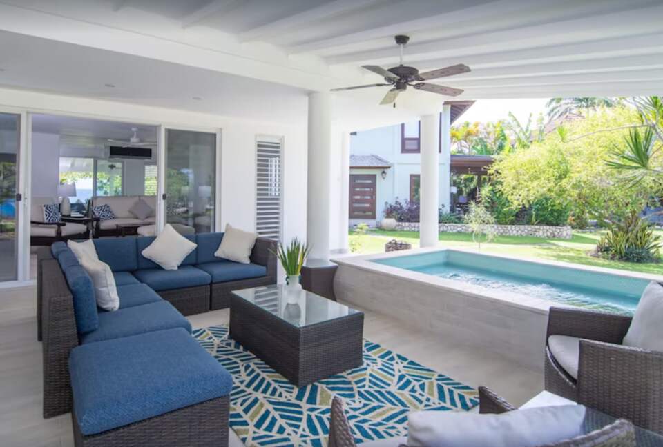 Private patio with lounge chairs and dining