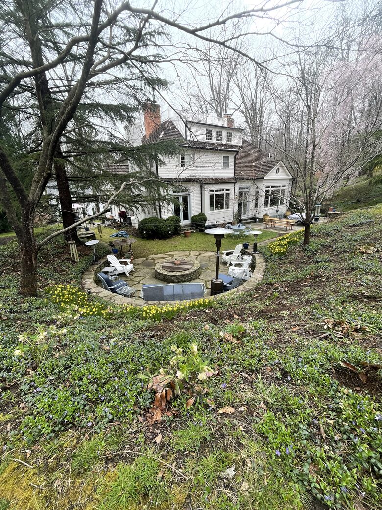 View from the upper lawn with fire pit and terraces