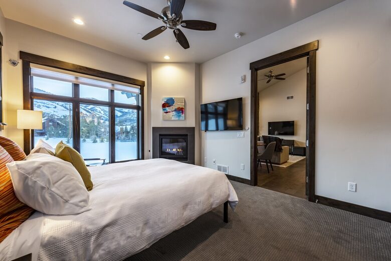 King bed in master with fireplace and TV