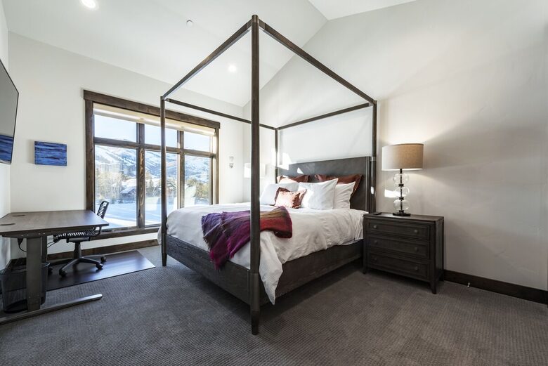 King bed and stand/sit desk in second master suite