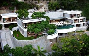 House sits on a cliffside, overlooking the ocean