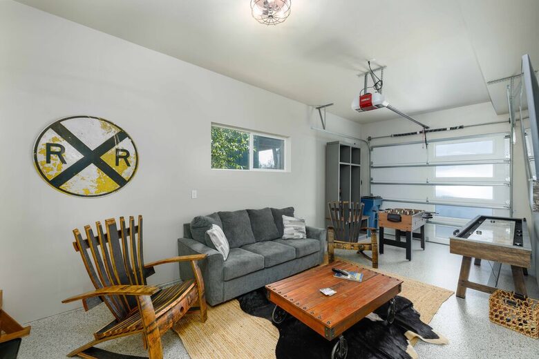 Garage is a game room with another TV area