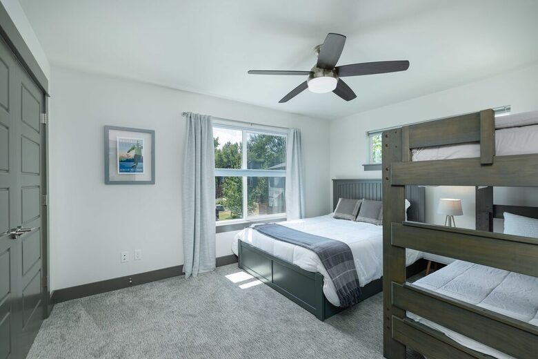 Third bedroom with queen bed and bunkbeds