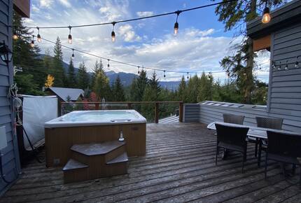 Private deck with hot tub and outdoor dining area