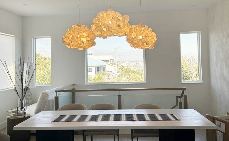 Dining table has custom lighting and great northern views