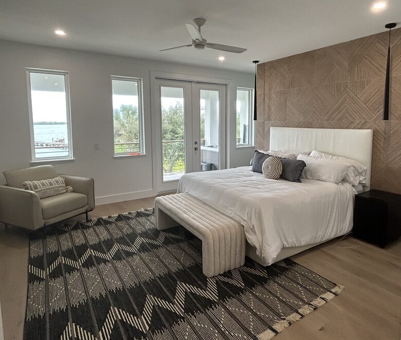Primary Bedroom with 55" TV, private covered deck & hot tub