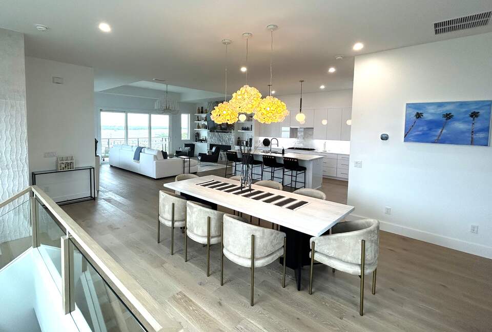 Open Plan dining, kitchen and great room opens to large deck