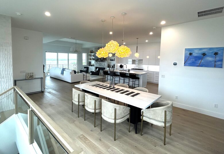 Open Plan dining, kitchen and great room opens to large deck