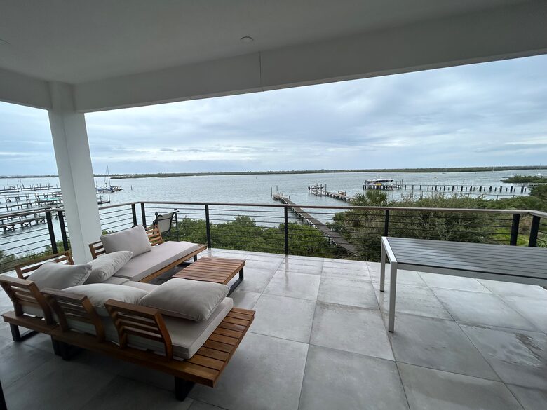 Spacious, covered, east facing 3rd floor waterfront deck