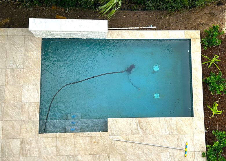 Pool view w/ raised waterfall wall from upper deck