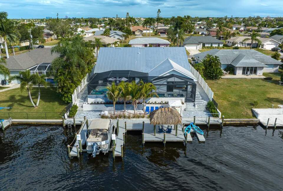 Resort Style Retreat | Gulf Access, Heated Pool & Spa, Boat Dock, Private Beach, Tiki Hut - Cape Coral, Florida