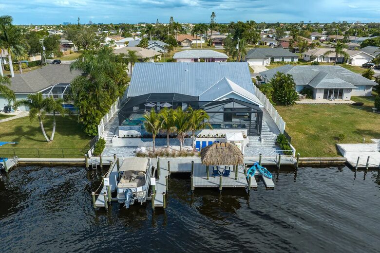 Resort Style Retreat | Gulf Access, Heated Pool & Spa, Boat Dock, Private Beach, Tiki Hut - Cape Coral, Florida
