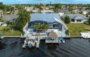 Resort Style Retreat | Gulf Access, Heated Pool & Spa, Boat Dock, Private Beach, Tiki Hut - Cape Coral, Florida