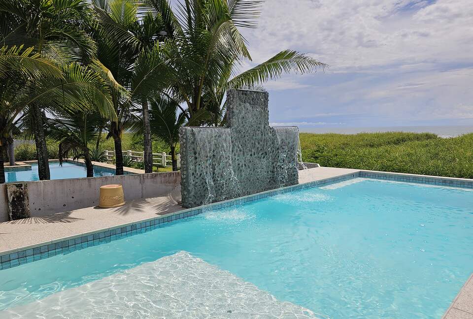 The focal point of the outdoor space is the large ocean-front pool