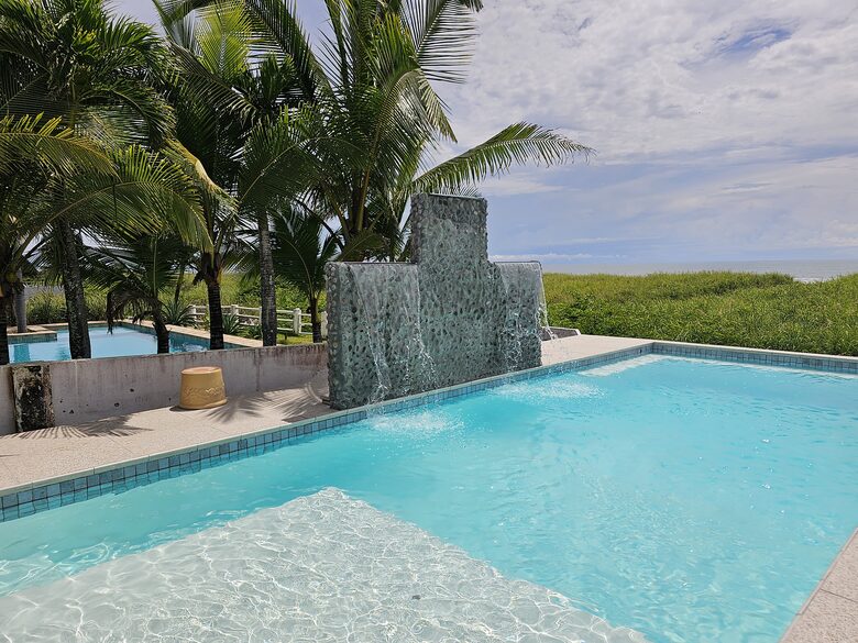 The focal point of the outdoor space is the large ocean-front pool