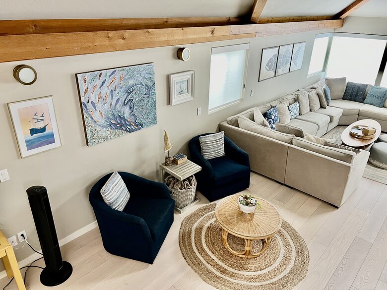 Looking down from stairs into living room.