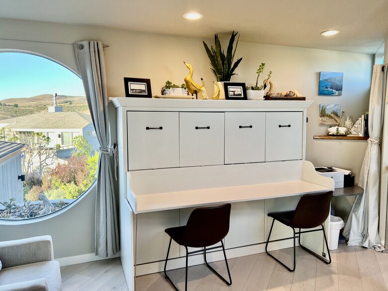 Landing area with desk which becomes full size Murphy bed.