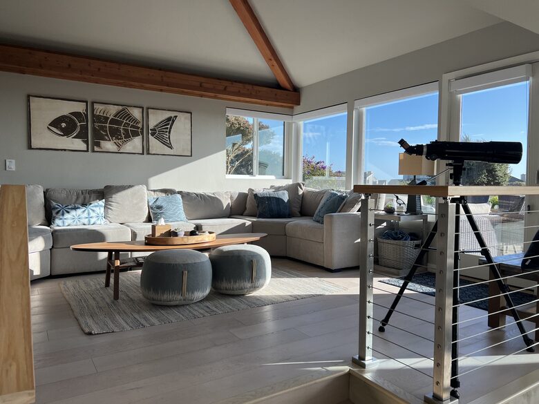 Lots of natural light and large sofa in living room.