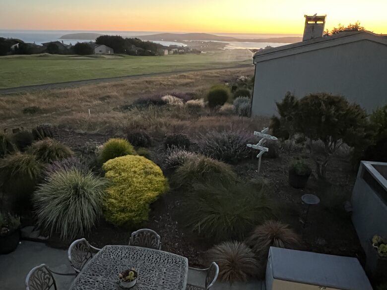 View from primary bedroom balcony at sunset.
