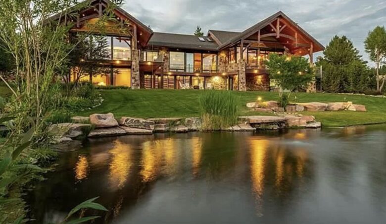 Back of the home that looks toward the mountains, with pond.
