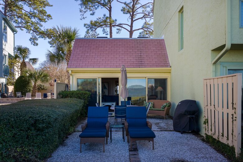 patio with lounge chairs, dining set and grill