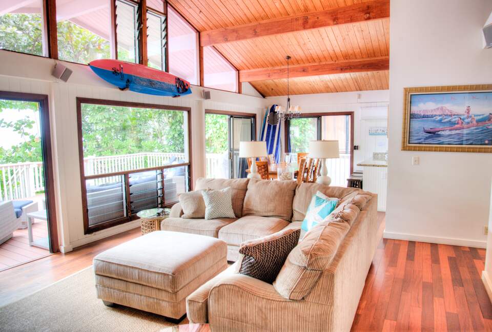 Living Room overlooking outdoor deck, beach, ocean and sunset