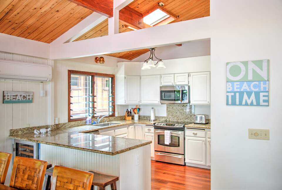 Fully stocked kitchen w/ sub-zero fridge and sub-zero wine fridge.