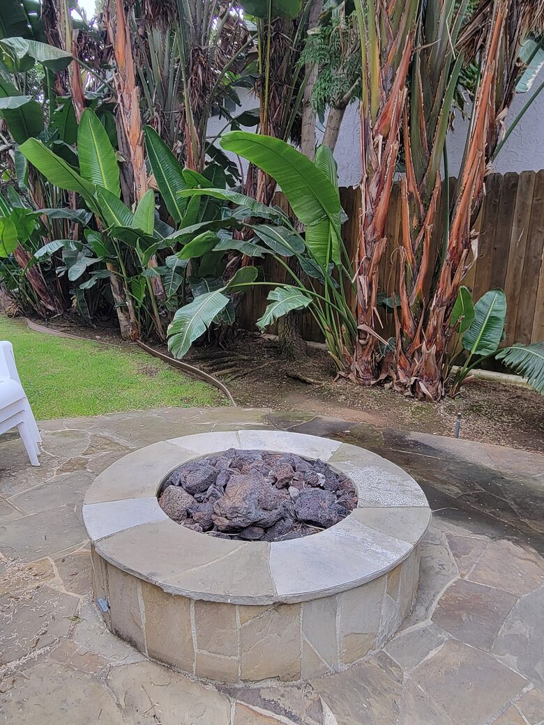 Cozy fire pit in complex back yard, perfect for relaxing with s’mores